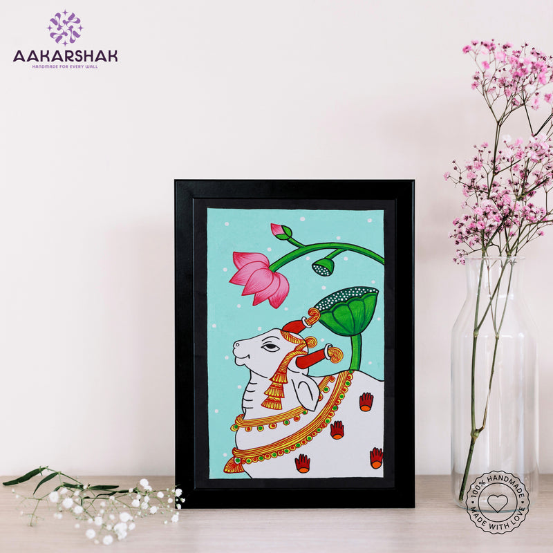 Framed artwork of an cow pichwai painting with sky background-with tabletop stand for home decor