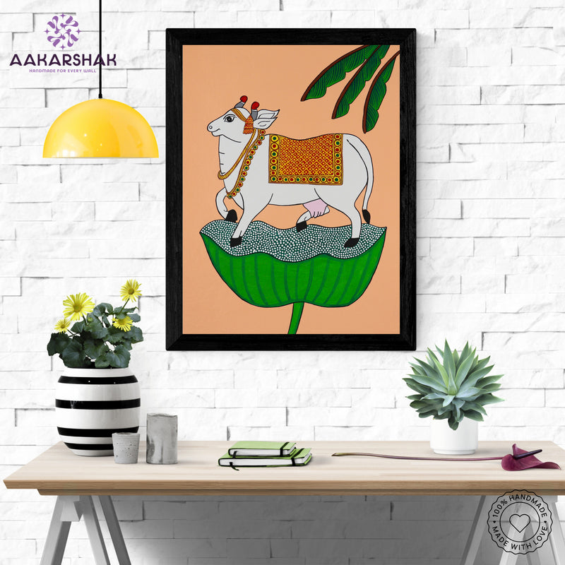 Framed artwork with cow design on a peach background-handmade pichwai painting for home decor