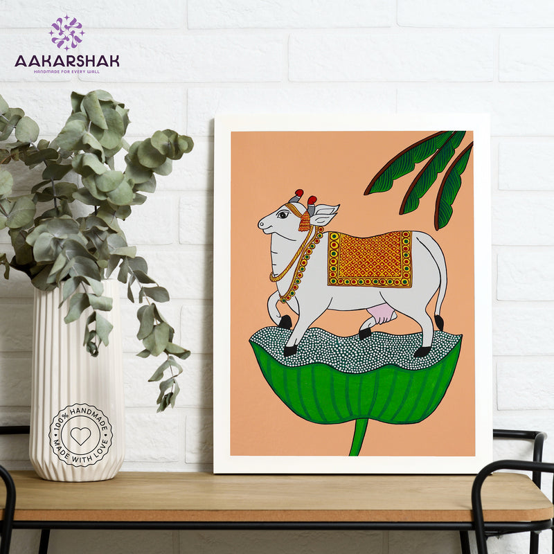 Framed artwork with cow design on a peach background-handmade pichwai painting for home decor