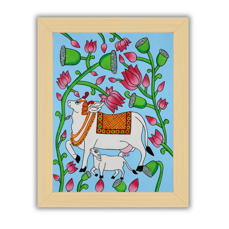 Framed artwork of a colorful cow illustration on a blue background-with handmade pichwai painting