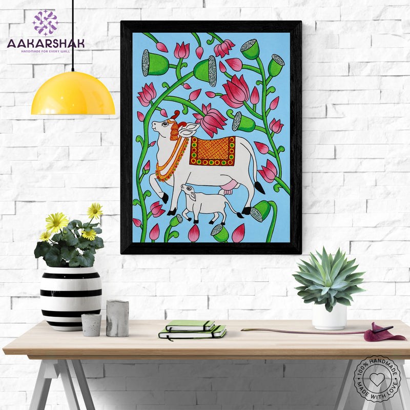 Framed artwork with cow design on a blue background-handmade pichwai painting for home decor