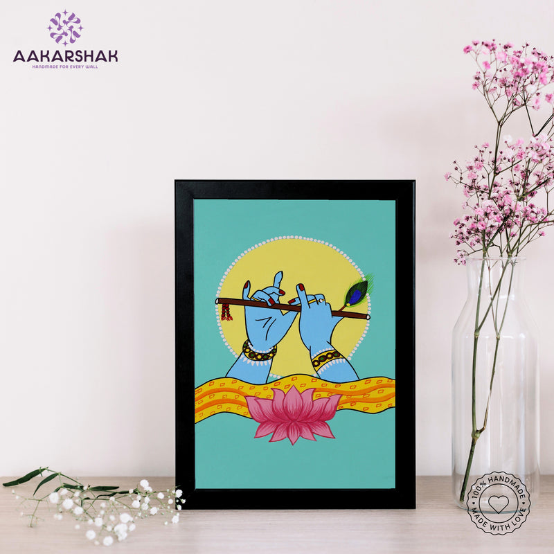 Framed artwork with krishna hands playing a flute on a teal background-with tabletop stand for home decor
