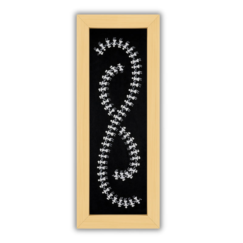Framed artwork of a colorful dancing-with handmade warli painting
