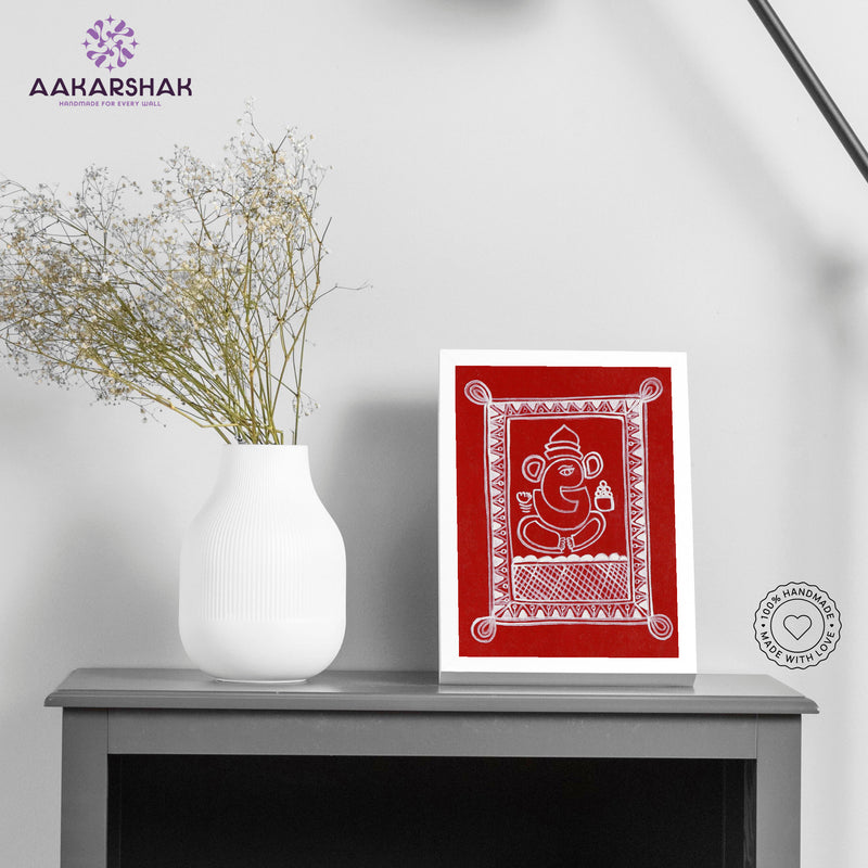Framed artwork of a white Ganesha design on a red background-with tabletop stand for home decor