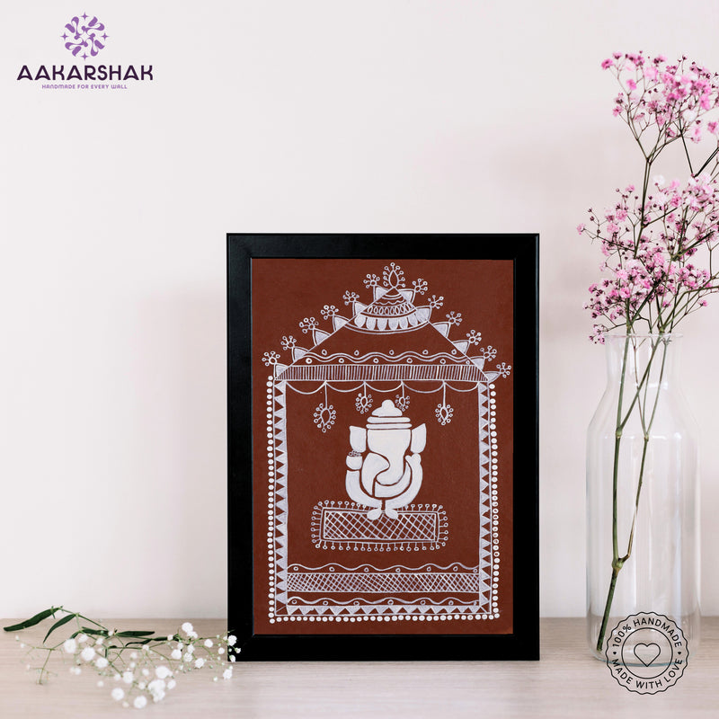 Framed artwork with white ganesh warli painting on a brown background-with tabletop stand for home decor