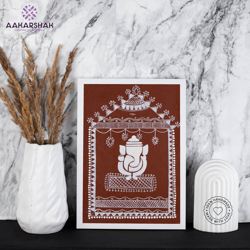 Framed artwork with white ganesh warli painting on a brown background-with tabletop stand for home decor