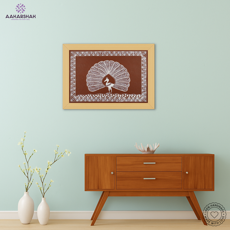 Framed artwork with white peacock design on a brown background-handmade warli painting for home decor