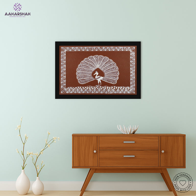Framed artwork with white peacock design on a brown background-handmade warli painting for home decor