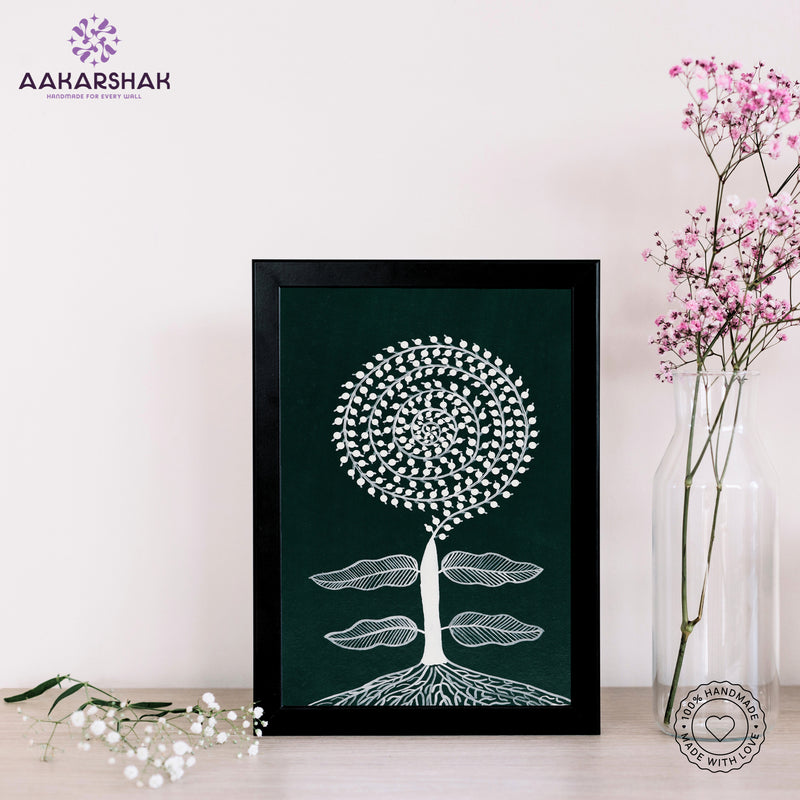 Framed artwork of a white tree design on a dark green background-handmade warli tree painting-with tabletop stand for home decor