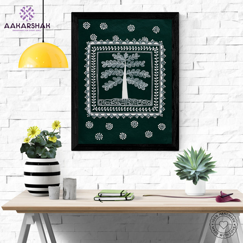 Framed artwork with white tree of life design on a green background-handmade warli painting for home decor