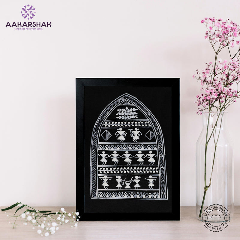 Framed artwork with village warli design on a black background- handmade with tabletop stand for home decor