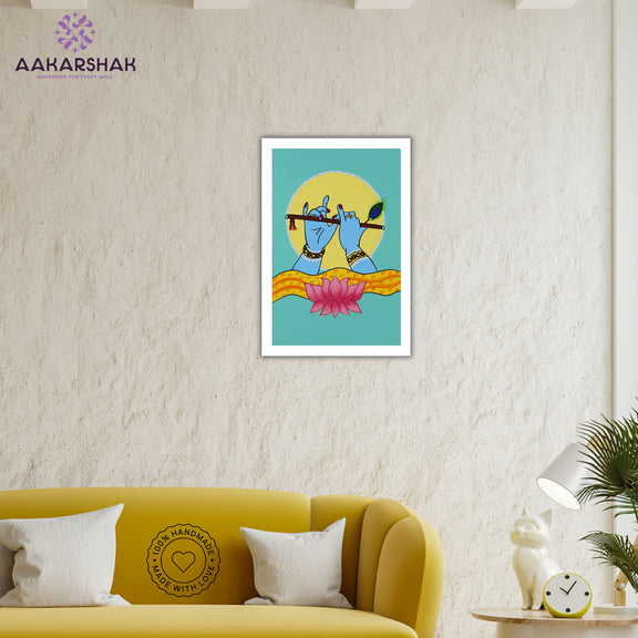 Framed artwork of hands playing a flute with a lotus-vibrant handmade krishna painting-depicting indian folk traditions
