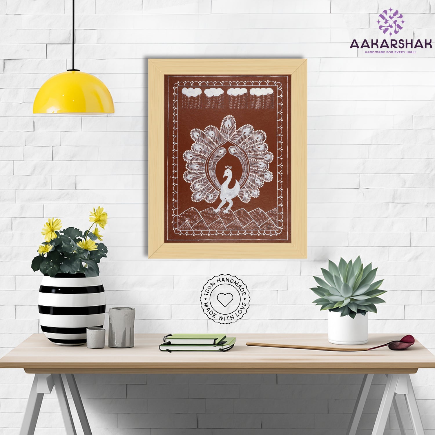 Framed artwork with white peacock design on a brown background-handmade warli painting for home decor