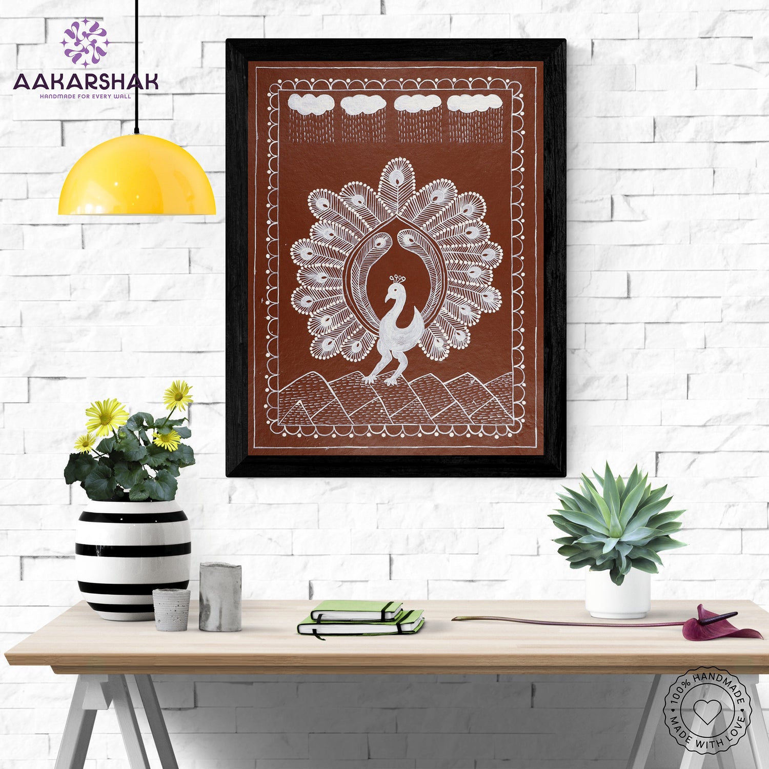 Framed artwork with white peacock design on a brown background-handmade warli painting for home decor