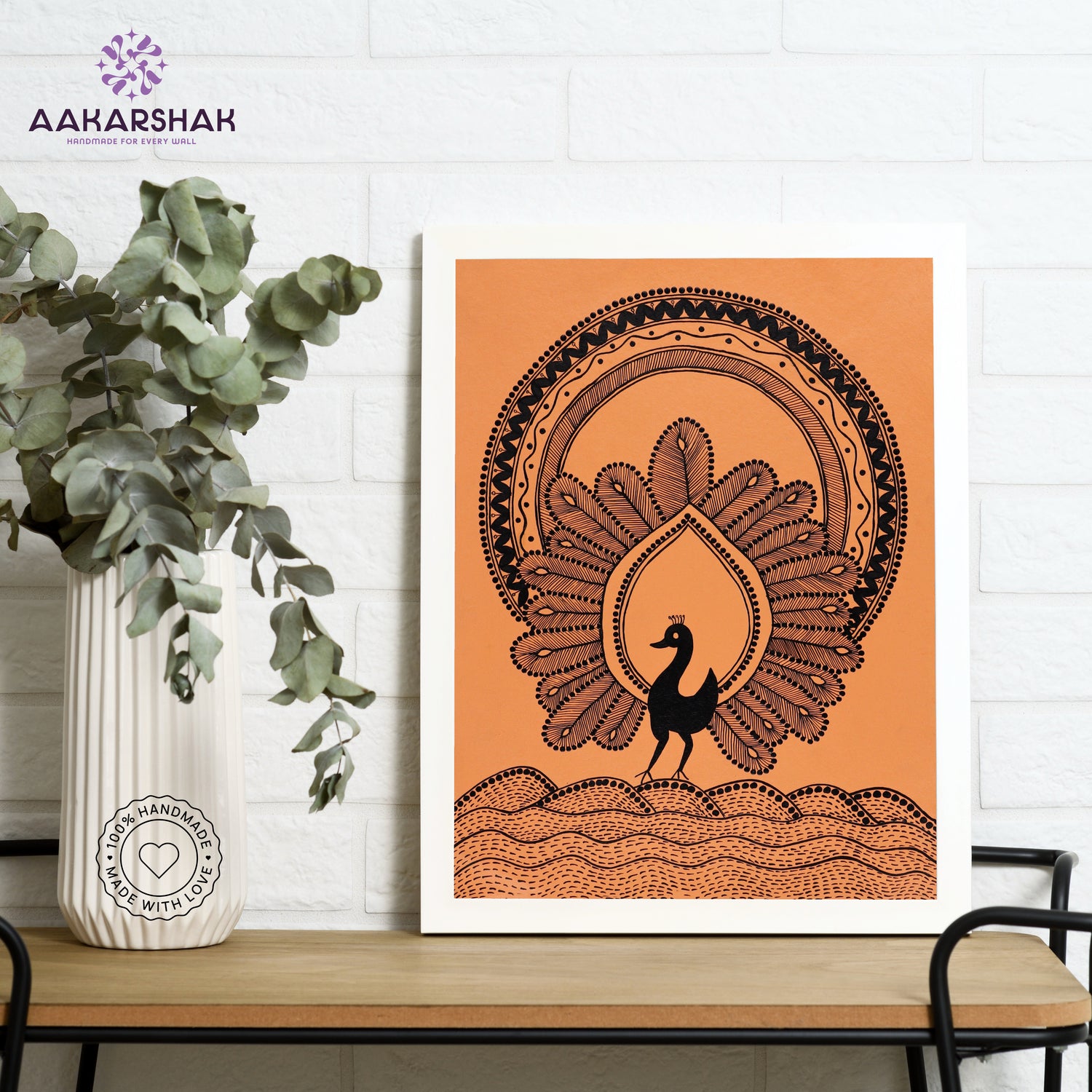 Framed artwork with white peacock design on a orange background-handmade warli painting for home decor
