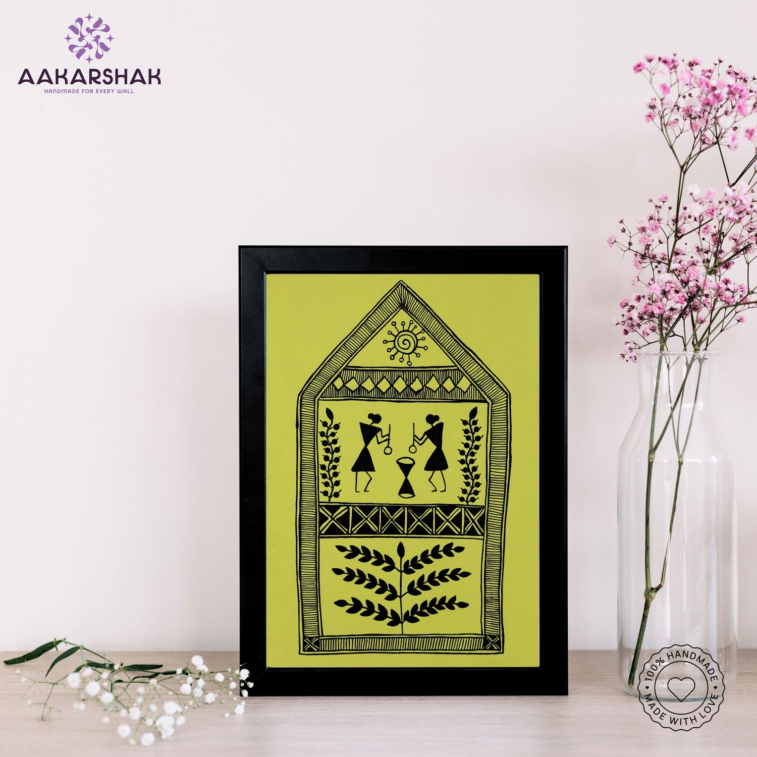 Framed artwork with village warli design on a yellow background- handmade with tabletop stand for home decor
