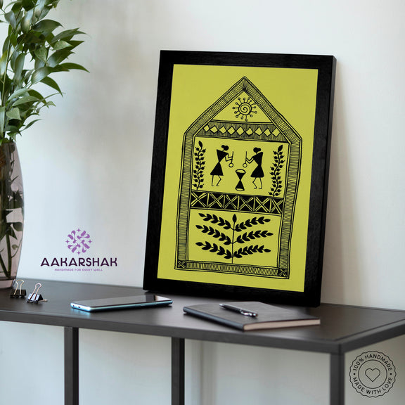 Framed artwork with a yellow background and black design-vibrant handmade village painting-depicting indian folk traditions
